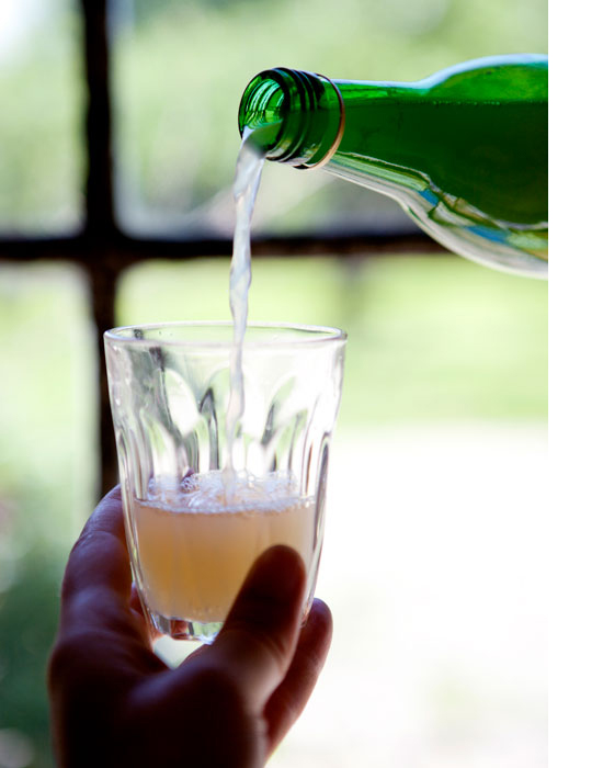 Pouring a glass of apple juice