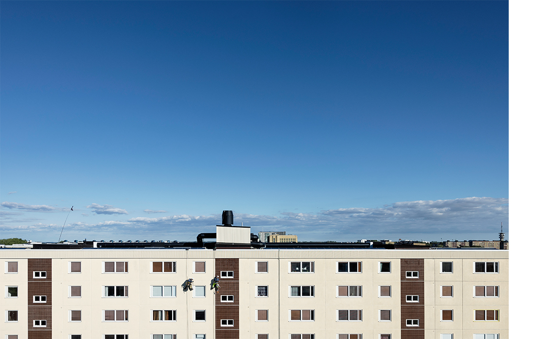 A high-rise building with a background of blue sky